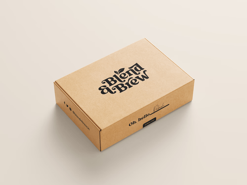 A brown cardboard shipping box featuring the black "Blend & Brew" logo on top.